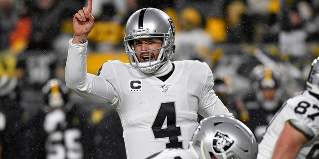 Las Vegas Raiders quarterback Derek Carr (4) calls signals during the first half of an NFL football game against the Pittsburgh Steelers in Pittsburgh, Saturday, Dec. 24, 2022. 