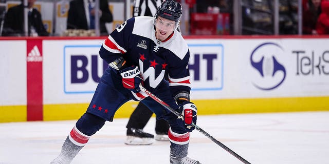 Dmitry Orlov of the Washington Capitals skates with the puck against the San Jose Sharks during the second period of a game at Capital One Arena Feb. 12, 2023, in Washington, D.C.