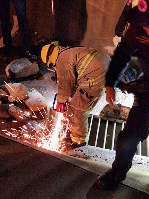 The fire department had to use a circular saw and other high-powered tools to pry open the storm drain and complete the rescue.