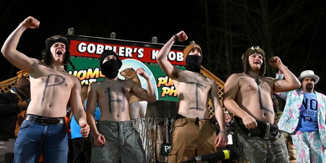 A group of spectators entertain the crowd while waiting for Punxsutawney Phil, the weather prognosticating groundhog, to come out and make his prediction during the 137th celebration of Groundhog Day on Gobbler's Knob in Punxsutawney, Pa., Thursday, Feb. 2, 2023. 