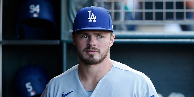 Gavin Lux #9 of the Los Angeles Dodgers looks on from the dugout before the game against the San Francisco Giants at Oracle Park on August 1, 2022 in San Francisco, California.