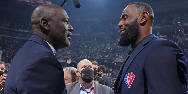 NBA Legends Michael Jordan and LeBron James shake hands during the 2022 NBA All-Star Game Feb. 20, 2022, at Rocket Mortgage FieldHouse in Cleveland. 