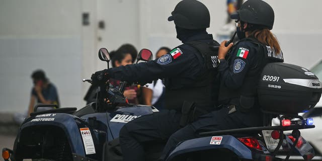 Members of the police on an ATV in Playa del Carmen, Quintana Roo, Mexico, on April 29, 2022.