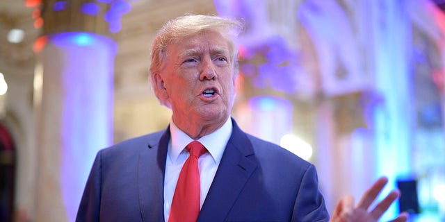 Former President Donald Trump answers questions from reporters during an election night party at Mar-a-Lago, Tuesday, November 8, 2022 in Palm Beach, Florida. 