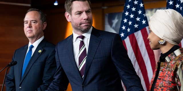 Reps. Eric Swalwell, D-Calif., center, Adam Schiff, D-Calif., and Ilhan Omar, D-Minn., conduct a news conference on being removed from committees assignments, in the Capitol Visitor Center on Wednesday, January 25, 2023. 