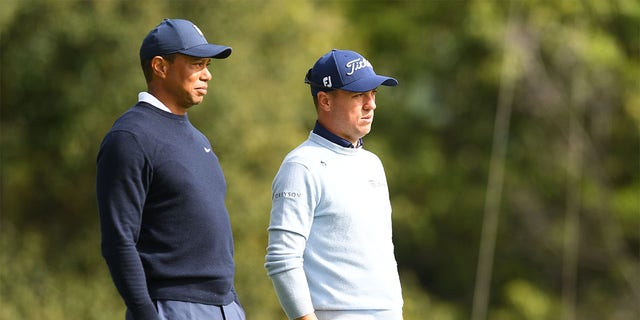 Tiger Woods and Justin Thomas look on at the eighth hole during the first round of the Genesis Invitational on Feb. 16, 2023.