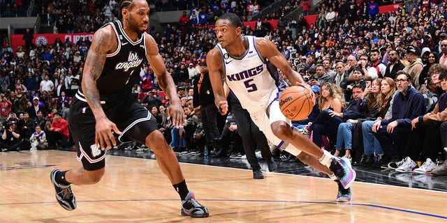 De'Aaron Fox, #5 of the Sacramento Kings, dribbles the ball during the game against the LA Clippers on February 24, 2023, at Crypto.Com Arena in Los Angeles, California. 