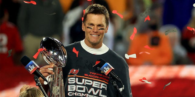 Tom Brady, #12 of the Tampa Bay Buccaneers, hoists the Vince Lombardi Trophy after winning Super Bowl LV at Raymond James Stadium on February 7, 2021 in Tampa, Florida. The Buccaneers defeated the Chiefs 31-9.