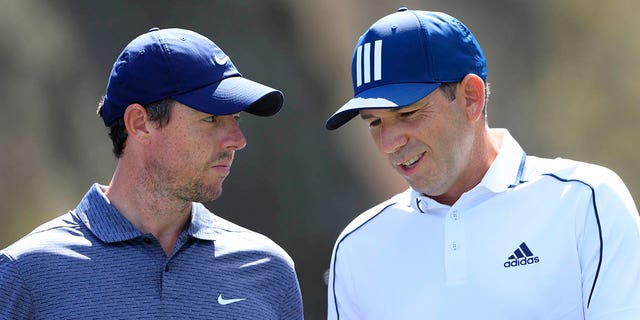 Rory McIlroy, left, talks to Sergio Garcia during the first round of THE PLAYERS Championship on THE PLAYERS Stadium Course at TPC Sawgrass on March 11, 2021 in Ponte Vedra Beach, Florida. 