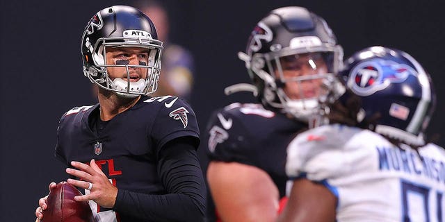 A. J. McCarron, #5 of the Atlanta Falcons, looks to pass against the Tennessee Titans during the first half at Mercedes-Benz Stadium on Aug. 13, 2021 in Atlanta.