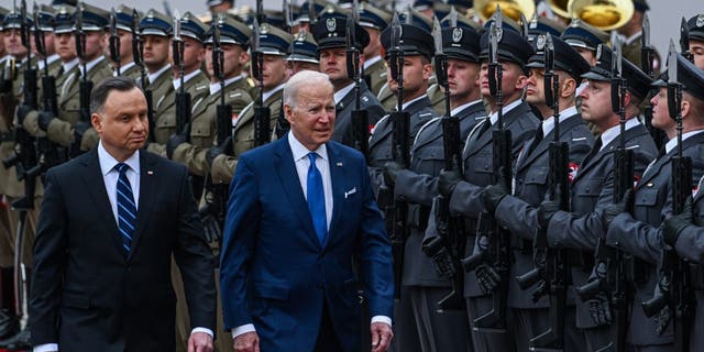 Polish President Andrzej Duda and President Biden inspects the Polish guard at the presidential Palace on March 26, 2022 in Warsaw, Poland. 