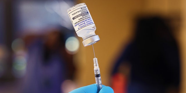 A pharmacist prepares to administer COVID-19 vaccine booster shots on September 9, 2022 in Chicago, Illinois.