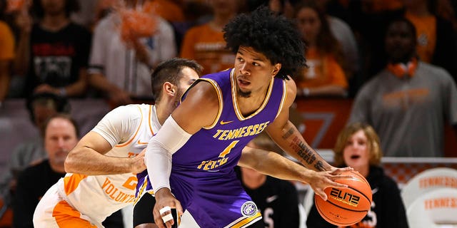 Santiago Vescovi #25 of the Tennessee Volunteers steals the ball from Diante Wood #1 of the Tennessee Tech Golden Eagles in the first half at Thompson-Boling Arena on November 07, 2022 in Knoxville, Tennessee. 