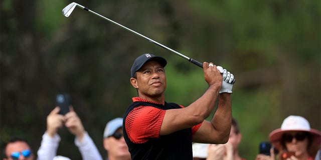 Tiger Woods plays his tee shot on the fourth hole during the final round of the 2022 PNC Championship at The Ritz-Carlton Golf Club Dec. 18, 2022, in Orlando, Fla. 