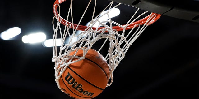 A basketball goes through the hoop during the game between the Memphis Tigers and the Cincinnati Bearcats at Fifth Third Arena on January 22, 2023, in Cincinnati, Ohio. 