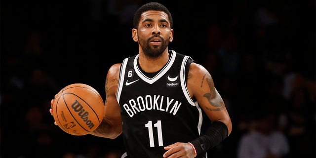 Kyrie Irving #11 of the Brooklyn Nets dribbles during the second half against the Los Angeles Lakers at Barclays Center on January 30, 2023 in the Brooklyn borough of New York City. The Nets won 121-104. 