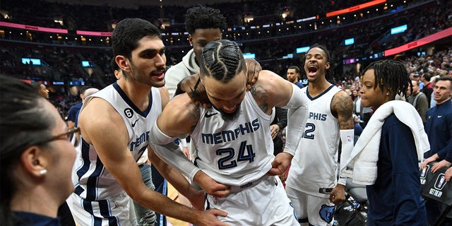 Teammates joke with Dillon Brooks, #24 of the Memphis Grizzlies, after her was ejected for fighting with Donovan Mitchell, #45 of the Cleveland Cavaliers, during the third quarter at Rocket Mortgage Fieldhouse on Feb. 2, 2023 in Cleveland. The Cavaliers defeated the Grizzlies 128-113. 