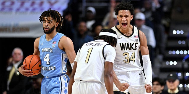 Bobi Klintman, #34, and Tyree Appleby, #1 of the Wake Forest Demon Deacons, reacts after a foul against R.J. Davis, #4 of the North Carolina Tar Heels, during the first half of their game at Lawrence Joel Veterans Memorial Coliseum on Feb. 7, 2023 in Winston-Salem, North Carolina.