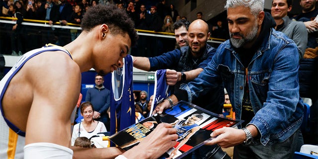 Victor Wembanyama, #1 of Boulogne-Levallois Metropolitans 92, signs autographs after the match between Boulogne-Levallois and JDA Dijon at Palais des Sports Marcel Cerdan on Feb. 10, 2023 in Levallois-Perret, France. 