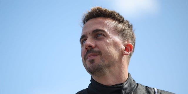 Frankie Muniz, driver of the #30 Hair Club Ford, walks the grid prior to the ARCA Menards Series BRANDT 200 Supporting Florida FFA at Daytona International Speedway on February 18, 2023 in Daytona Beach, Florida. 