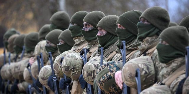 Ukrainian soldiers during a service, on February 23, 2023, near Salisbury, England. Ahead of tomorrow's anniversary of the Russian Invasion of Ukraine, hundreds of soldiers from the armed forces of Ukraine and their UK instructors come together to remember those who have lost their lives in the war on Ukraine. 