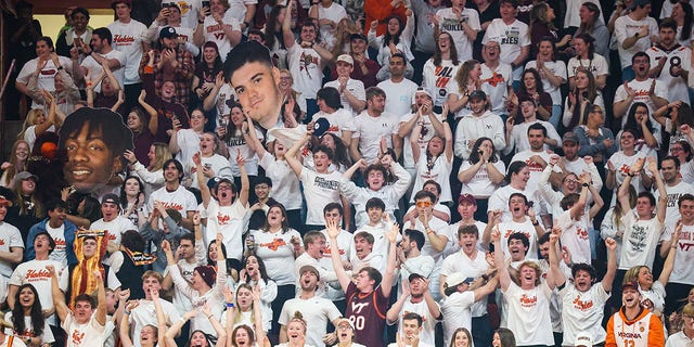 Virginia Tech Hokies fans cheer in the second half of the game against the Miami Hurricanes at Cassell Coliseum in Blacksburg, Virginia, on Tuesday.