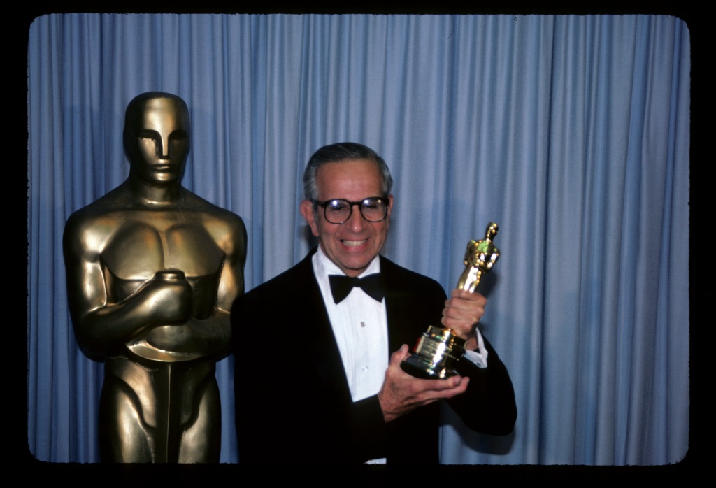  Walter Mirisch holds his Oscar award at the 55th annual Academy Awards.