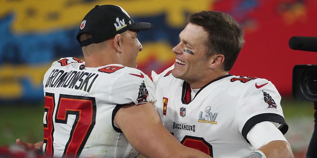 Buccaneers quarterback Tom Brady and tight end Rob Gronkowski celebrate after winning Super Bowl LV against the Kansas City Chiefs on Feb. 7, 2021, at Raymond James Stadium in Tampa, Florida.