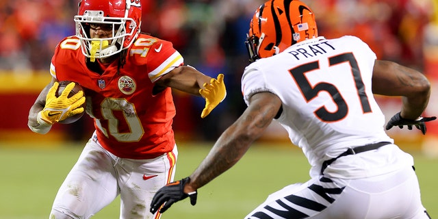 Isiah Pacheco (10) of the Kansas City Chiefs carries the ball against Germaine Pratt (57) of the Cincinnati Bengals during the third quarter in the AFC championship game at GEHA Field at Arrowhead Stadium Jan. 29, 2023, in Kansas City, Mo.