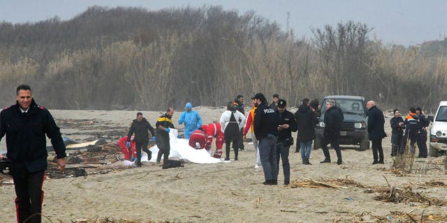 Rescuers scrambled to find survivors after a boat carrying about 150 migrants crashed into rocky reefs near Cutro, southern Italy, Sunday, Feb. 26, 2023. 