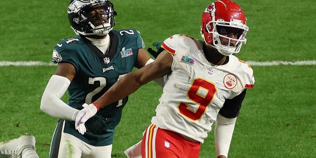 James Bradberry, #24 of the Philadelphia Eagles, is called for holding against JuJu Smith-Schuster, #9 of the Kansas City Chiefs, during the fourth quarter in Super Bowl LVII at State Farm Stadium on Feb. 12, 2023 in Glendale, Arizona.