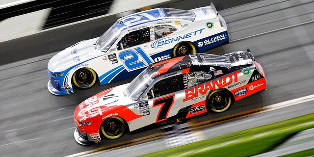 Justin Allgaier, driver of the #7 Brandt Chevrolet, and Austin Hill, driver of the #21 Bennett Transportation Chevrolet, race during the NASCAR Xfinity Series Beef. It's What's For Dinner. 300 on Feb. 18, 2023 in Daytona Beach.