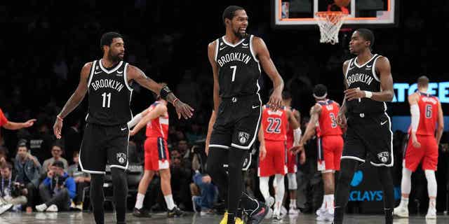 In the 2019 NBA free agency period, Kevin Durant signed with the Brooklyn Nets. Although he was ruled out the following season due to his torn achilles, he still signed a max contract. Durant teamed up with his long-time friend Kyrie Irving in Brooklyn with hopes of bringing a championship to New York City. Kevin Durant is seen above walking down the court between teammates Kyrie Irving, left, and Edmond Sumner, right, in a game against the Washington Wizards.