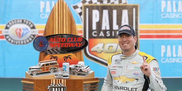 Kyle Busch, driver of the #8 Lucas Oil Chevrolet, celebrates in victory lane after winning the NASCAR Cup Series Pala Casino 400 at Auto Club Speedway on February 26, 2023 in Fontana, California.