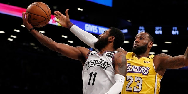 Kyrie Irving #11 of the Brooklyn Nets in action against LeBron James #23 of the Los Angeles Lakers at Barclays Center on January 23, 2020 in New York City.