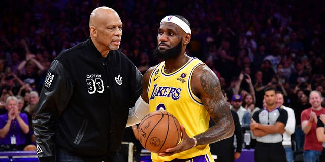 Los Angeles Lakers forward LeBron James (6) meets with former player Kareem Abdul-Jabbar after breaking the NBA all time scoring record against the Oklahoma City Thunder during the second half at Crypto.com Arena. 