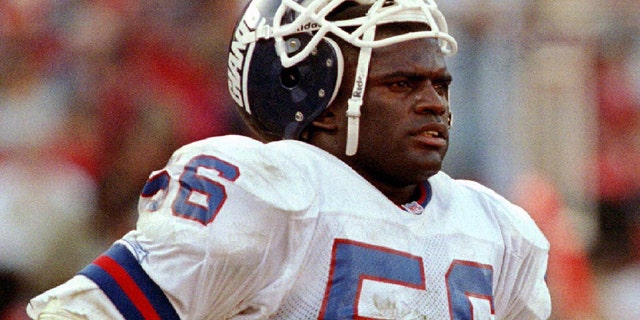 New York Giants linebacker Lawrence Taylor walks off the field after losing to the San Francisco 49ers, 44-3, in their NFC playoff game at Candlestick Park on Jan. 15, 1998.