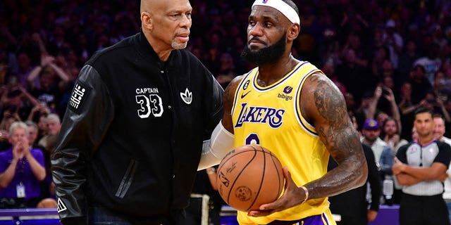 Lakers forward LeBron James meets with Kareem Abdul-Jabbar after breaking the NBA all-time scoring record against the Oklahoma City Thunder at Crypto.com Arena on Feb. 7, 2023, in Los Angeles.