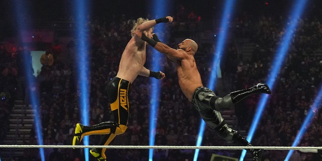 Logan Paul (left) and Ricochet battle during the men’s WWE Royal Rumble at the Alamodome in San Antonio Jan. 28, 2023.