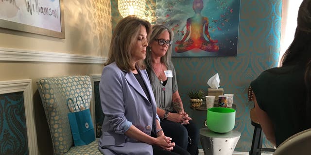 Democratic presidential candidate Marianne Williamson leads a mediation in Manchester, New Hampshire, on Sept. 9, 2019.