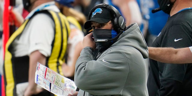 Detroit Lions head coach Matt Patricia adjusts his mask during the second half of a game against the Houston Texans Nov. 26, 2020, in Detroit.