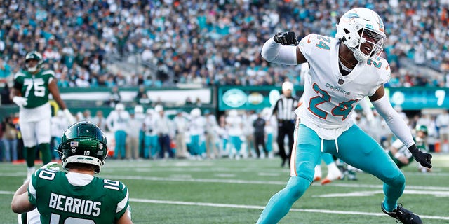 Byron Jones (24) of the Miami Dolphins reacts after breaking up a touchdown pass intended for Braxton Berrios (10) of the New York Jets in the first quarter at MetLife Stadium Nov. 21, 2021, in East Rutherford, N.J.