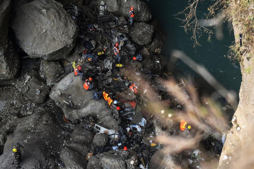 Rescue teams search for victims at the site of the Yeti Airlines plane crash, in Pokhara on January 17, 2023.