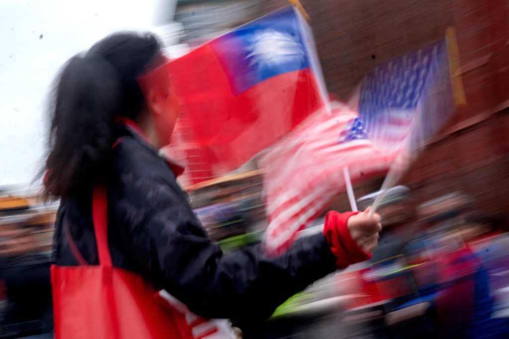 A person waves flags from Taiwan and the United Stated during a Lunar New Year celebration in Washington, D.C., Jan. 22.