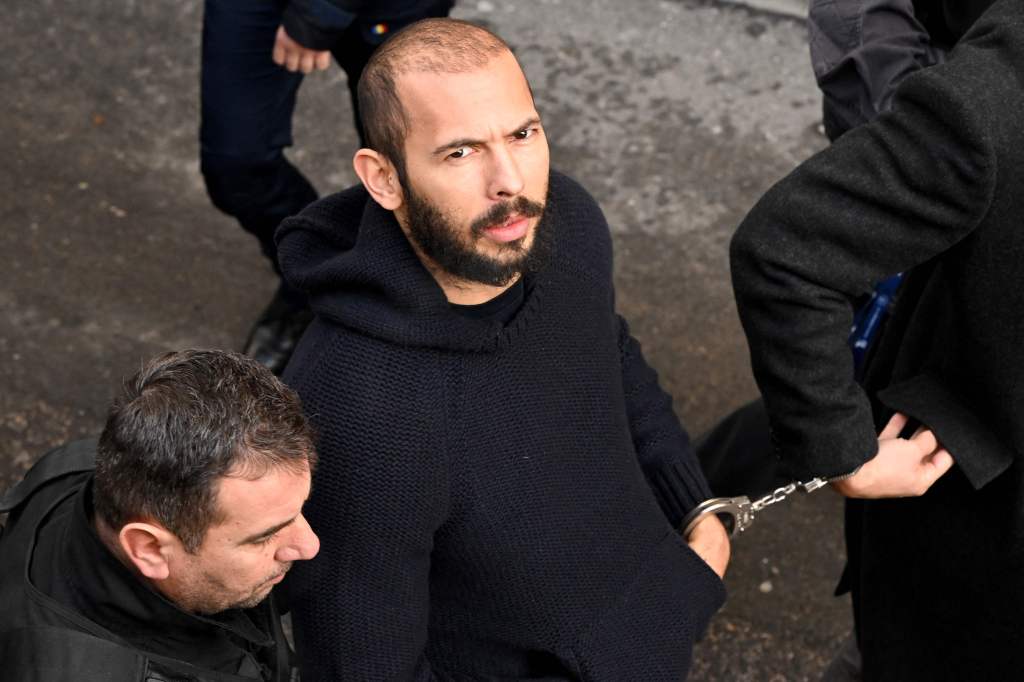 Andrew Tate in cuffs at a Romania courthouse.