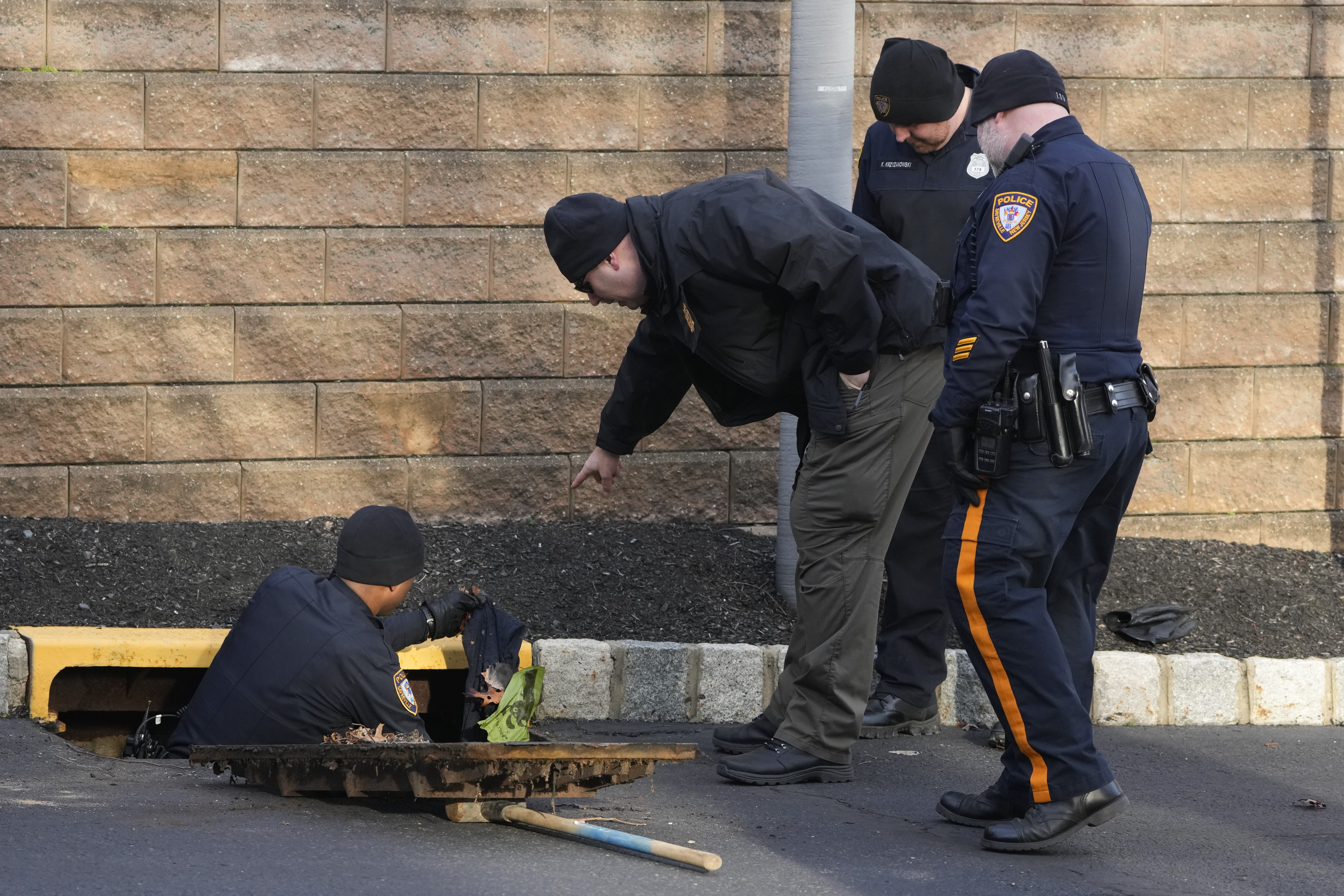 Cops scouring the scene for possible evidence.