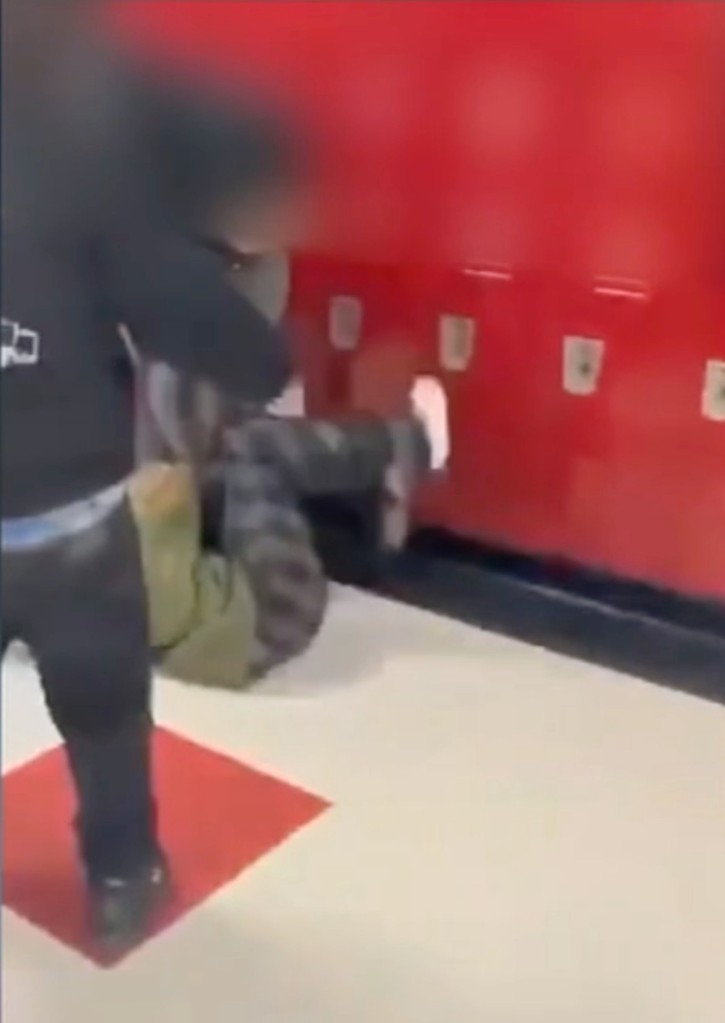 A screenshot of the recorded assault in the school hallways,