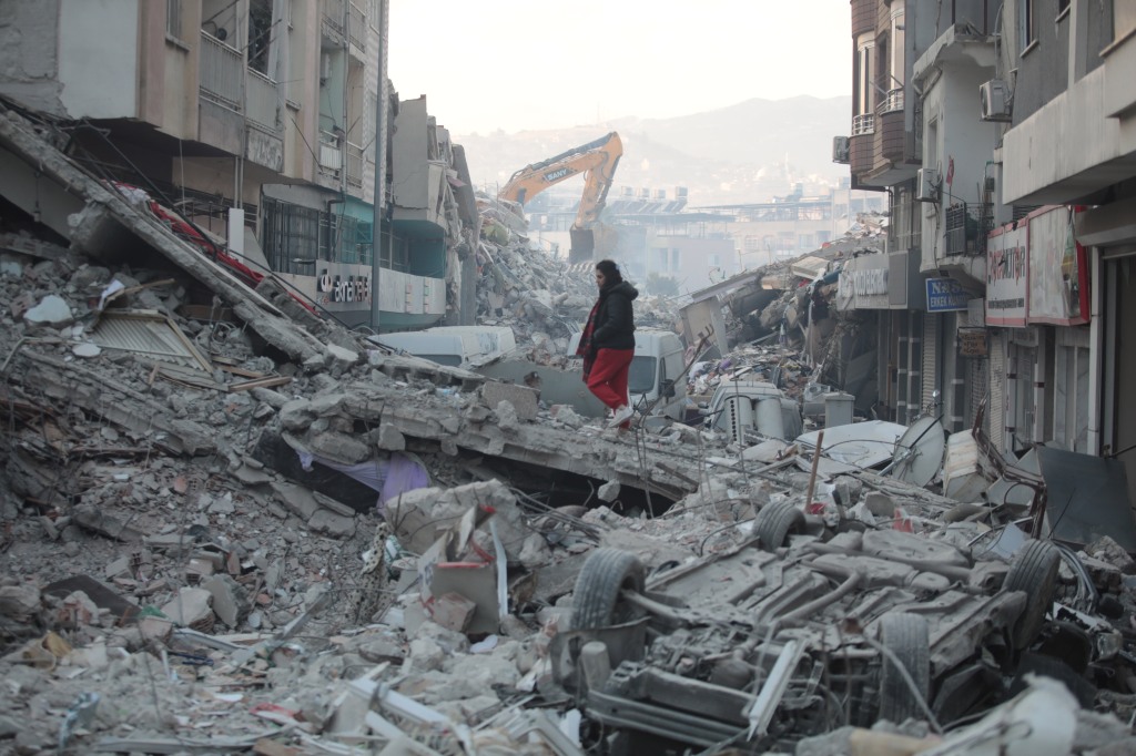 Search and rescue teams are working on collapsed buildings in Iskenderun, south Turkey.