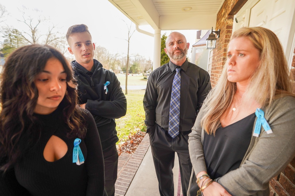 Michael Kuch, back right, with other members of Kuch's family at their home this week.