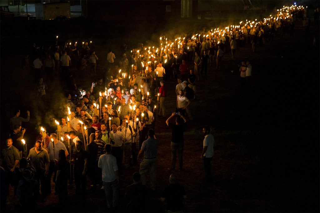 Neo Nazis, Alt-Right, and White Supremacists march through the University of Virginia Campus with torches in 2017.